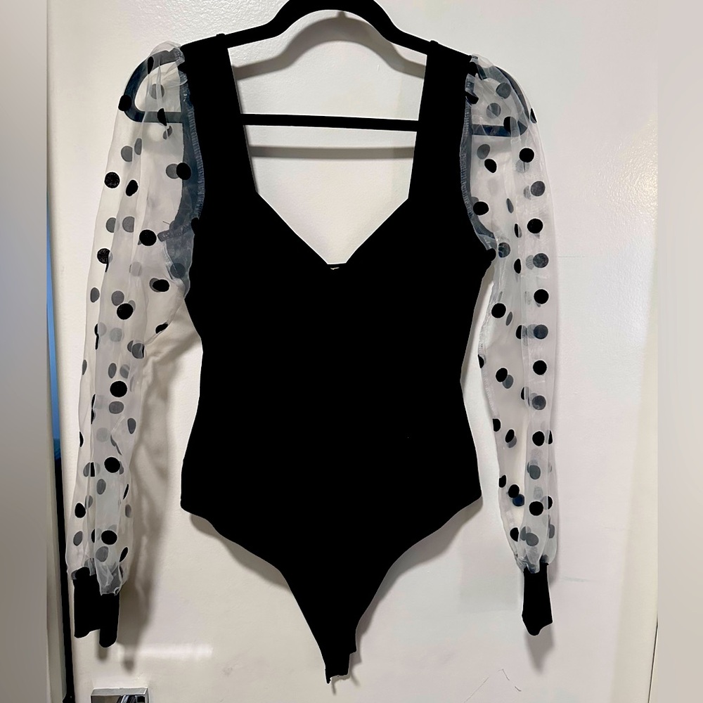 Black polka dot body suit